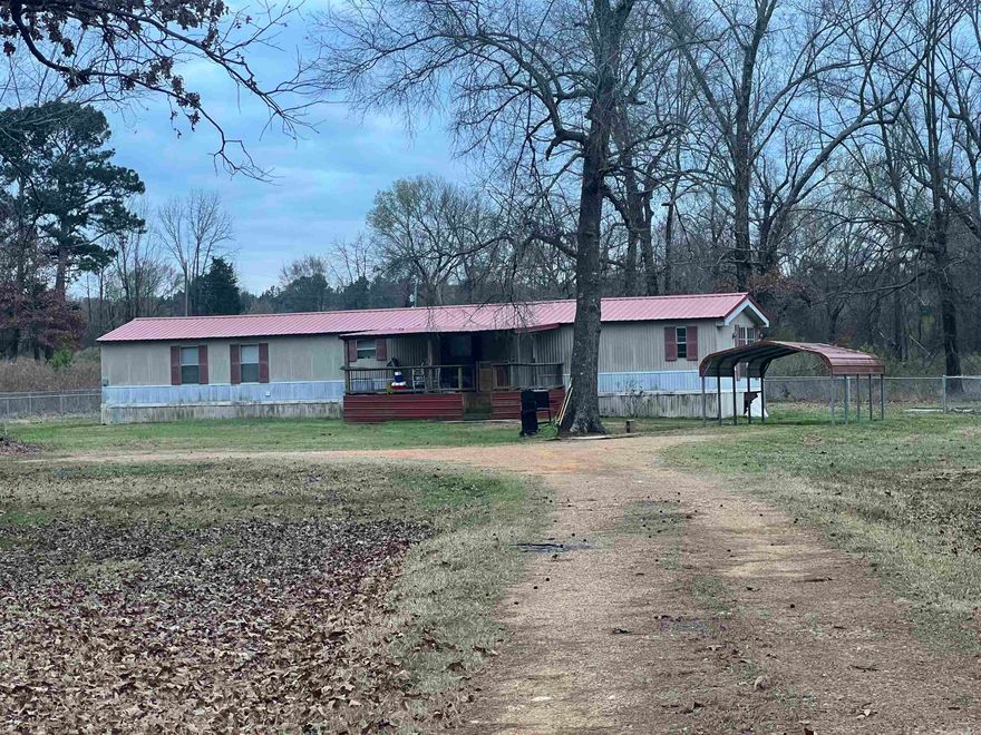 If you are looking for privacy and an affordable place to buy; look no further!!! This mobile home sits on 1.5 acres of land and has all new flooring that gives it a modern touch! 3 bed/ 2 bath mobile home with Central heat and air. Back yard has chain link fence for your pet! Call us today to schedule your showing.