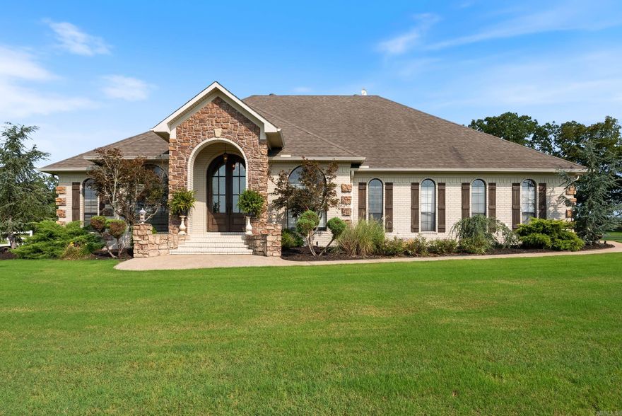 Seller offering 10,000 towards closing costs or rate buydown w/accepted offer! Situated on 3.93 acres, this stunning residence offers luxury & privacy. This one of a kind property has it all with no restrictions. Boasting 4BR/2.5BA, & 2,813 sqft, this home is the perfect place to call your own. The property welcomes you w/ a beautiful white vinyl fence, fully paved driveway, & extensive lush landscaping. The grand entry features gorgeous rock detail, stunning 11 ft arched mahogany doors & beautiful arched windows w/custom plantation shutters. Step inside to 12 ft ceilings & custom french country built-in entertainment center. Cozy up by the wood burning fireplace that is conveniently vented to warm bedrooms. The kitchen features granite countertops & stainless steel appliances. Enjoy evenings on the spacious covered back porch. The 2-bay 30x40 shop w/ a 1000 sqft lean-too is perfect for all your hobbies, projects & extra storage. The home acquires an in ground tornado shelter & extra storage/cabinet space in the garage & an in ground sprinkler system. Secluded, yet accessible, this home is located in top rated Greenbrier School District.