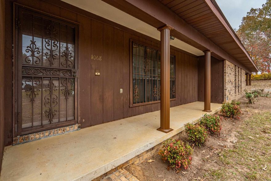 Welcome to this well built 3 bedroom home, 2.5 bath home on 1 acre off Ridge Road outside the city limits but close to everything. This spacious property features both a formal living room (or could be a dinning room or office) and a large den with fireplace offering plenty of room to entertain and spread out. Enjoy relaxing by the fireplace or sitting on the front porch or large back deck overlooking the peaceful surroundings. The roof was replaced 4 years ago and new flooring was just laid throughout the home so it is ready for you! The double carport provides convenient covered parking too! This home is ready for its next owners. There is also an additional 8.97 acres available too listed. Agents please see notes for more information.