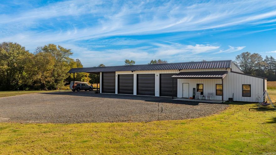 Welcome to this exceptional 54± acre property in the Greenbrier School District/Wooster Elementary School zone, featuring a stunning red iron shop house. The home offers 1,408 sq. ft. of heated and cooled living space with 9-foot ceilings, stained and sealed concrete floors, and tinted windows providing privacy and improved energy efficiency. Inside, you’ll enjoy central heat and air, an electric fireplace plus an emergency gas fireplace, a tankless water heater and much more. The kitchen comes fully equipped with all appliances conveying, including a gas oven, microwave, refrigerator and dishwasher. The 122' x 50' insulated red iron building includes a 30' x 50' lean-to, four electric insulated garage doors (three 12' x 12' and one 12' x 14'), and motorhome plug-ins on both sides. The shop also features a propane heater, an 18' x 50' storage loft above the living quarters, an office and a 6' x 10' safe room. The front yard is beautifully planted with bermuda grass. This beautiful acreage includes three ponds, two of which are spring-fed, offering natural beauty and versatility for recreation, livestock and peaceful country living.