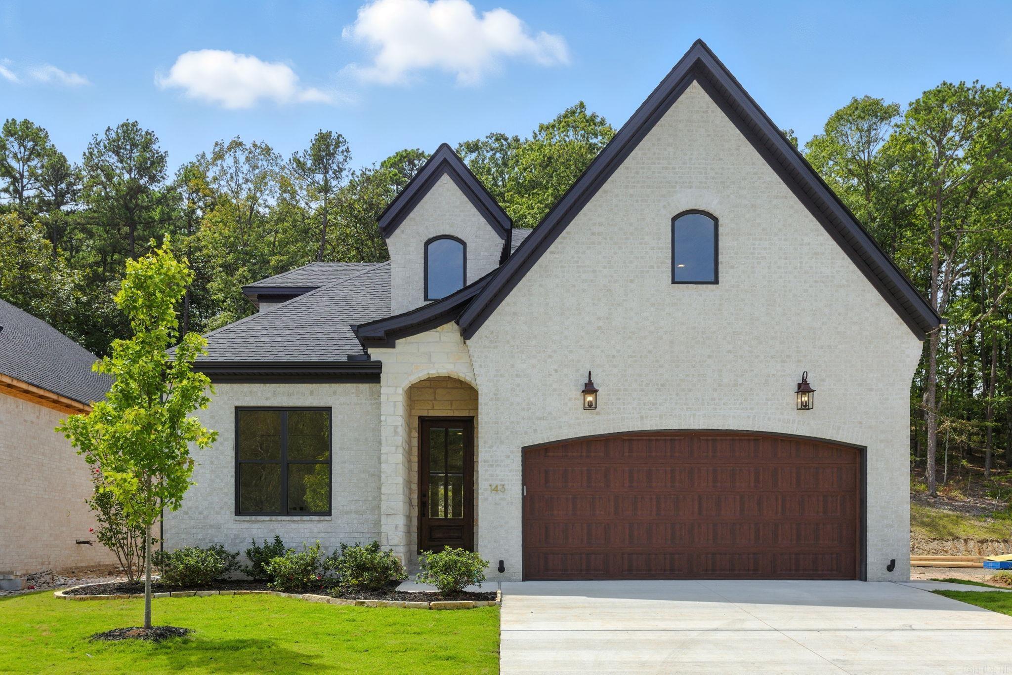 It's here! Walking distance to the brand NEW POOL & PARK area being built. This custom home boasts high-end features, including 10-foot ceilings and 8-foot wood doors. The spacious kitchen is a highlight, featuring a striking White Oak island and floor-to-ceiling cabinetry, top tier appliances. Large Pie Lot. The expansive living and dining area is filled w/ natural light. This open space is enhanced by an 11-foot tall coffered ceiling. The living area features a stone-wrapped fireplace w/ built-ins on either side, complete w/ white oak floating shelves that tie the space together. The massive master suite offers an 11-foot tray ceiling, creating a grand ambiance, along w/ a cozy reading nook. The master bathroom is distinct, featuring a glass-enclosed shower, a spacious FS tub, and a double sink vanity. A large walk-in closet provides access to the conveniently located laundry room, which includes a sink. The downstairs also includes 2 additional bedrooms and a pro-designed full bathroom w/ tub wrapped in stylish tile. Upstairs, you'll find a full playroom, a fourth bedroom w/ walk-in closet, and a third full bathroom also tub wrapped in tile! One of a kind home!