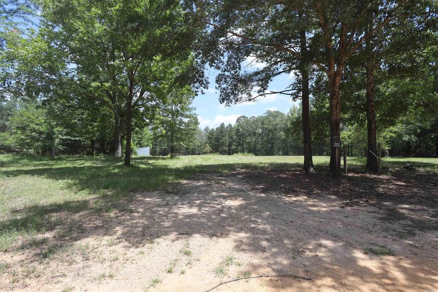 A great home place for the nature lover. This 3 acres has Access to Electricity, has rural water and it's own well. A concrete septic tank and field lines are already on site.