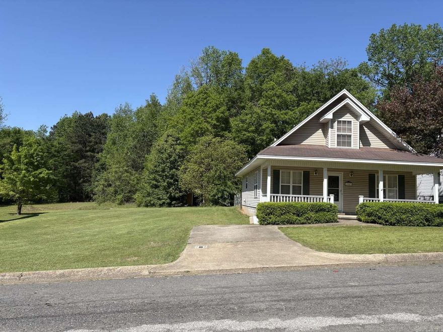 Home plus extra lot! Great starter home or income property! This cute cottage style home is 2 stories with primary bedroom and bath downstairs and additional 2 bedrooms and bath upstairs. All new LVP flooring throughout the home was just recently installed. All appliances will convey. New central heat & air was installed in 2020. New water heater was installed in 2023. Ample pantry and closet space throughout with a unique area under the stairs to use for shelter in severe weather. This home features a back patio area with fenced in yard just off the kitchen as well as a covered front porch that spans the width of the home. This home is on a dead end street in a quiet neighborhood and the property not only includes the house and lot but also an additional lot adjacent to it which could be used as additional yard space, used to build another home or shop, or sold separately. Lots of options with this home conveniently located off of Walnut and close to Ouachita Baptist University and Henderson State University! Immediate possession upon closing. This home has been professionally cleaned and can be shown anytime!