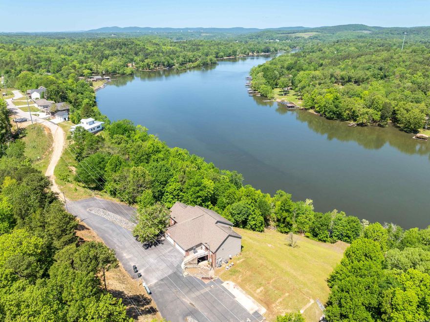 Large views of Lake Catherine from this charming Condo. This beautifully updated 3-BR., 2-BA. unit offers 1,626 square feet of thoughtfully designed living space with a split floor plan that provides privacy and versatility. Step directly into comfort with convenient walk-in level access—no stairs to navigate when bringing in groceries or moving furniture! The interior has been refreshed throughout with contemporary finishes that blend style and functionality, creating a space that feels both modern and timeless. The peaceful setting provides a perfect backdrop for both relaxation and entertainment. The primary bedroom offers a private sanctuary away from the other bedrooms, enhancing the sense of spaciousness throughout the home. Each space has been thoughtfully considered to maximize comfort and livability. Whether you're seeking a vacation getaway, a retirement haven, or simply a beautiful place to call home, this condo delivers with its perfect blend of location, updates, and natural beauty. Your lake view lifestyle awaits!