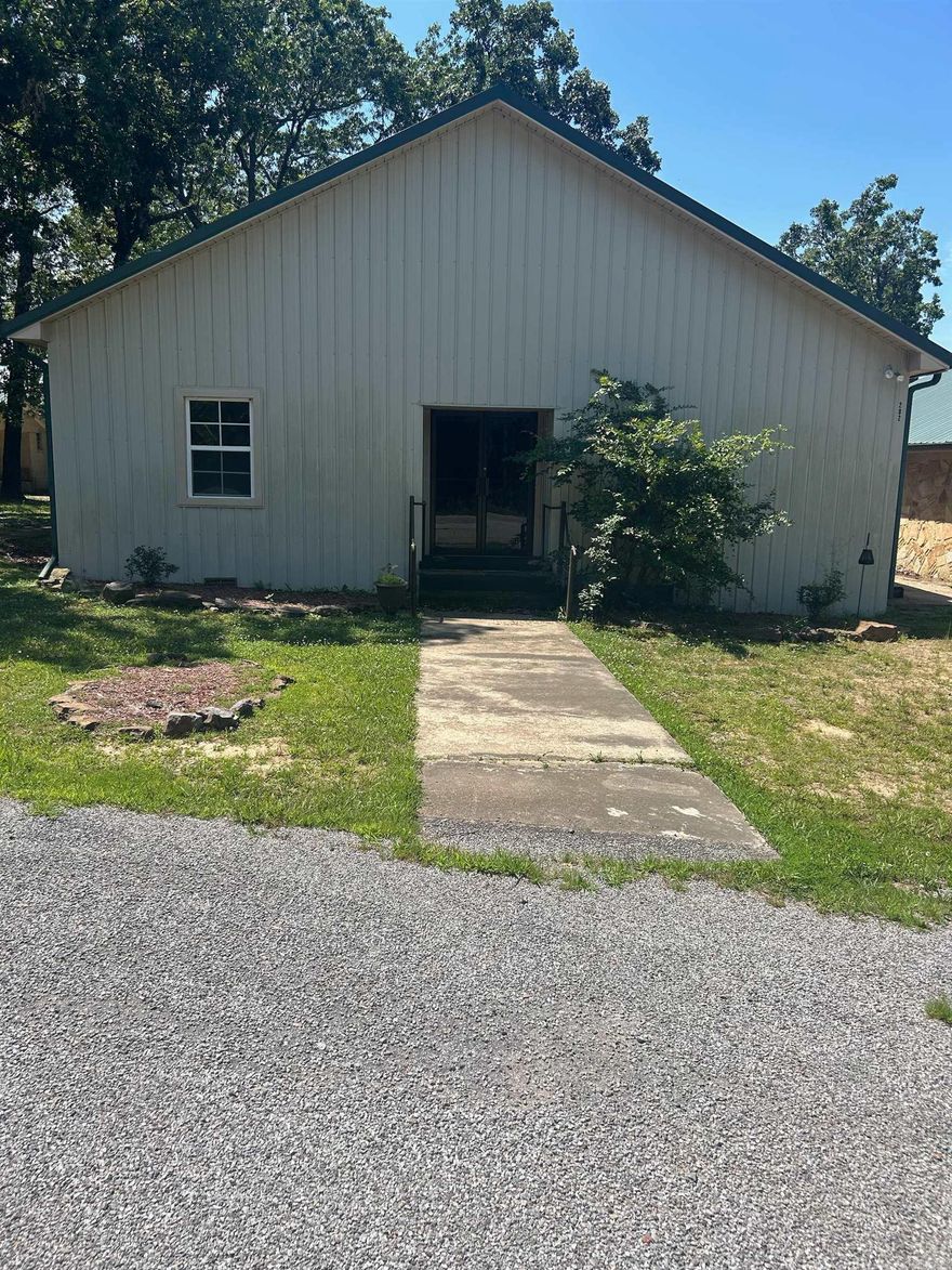 Rock building has open floor plan , Metal building has 3 beds, 3 bath was recently used as a rehab facility.  Large concrete pad in the back     To be sold as RESIDENTAL ONLY  Example no rehab facility etc.  Good bones could be made into a house and or duplex