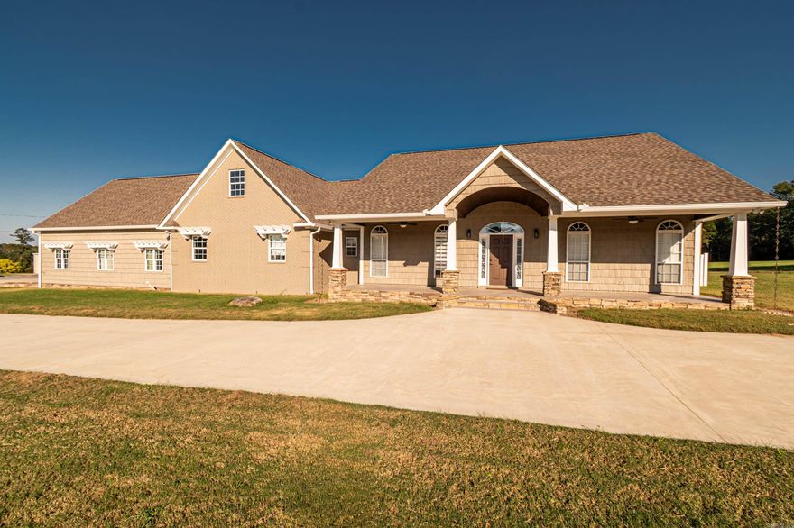 Discover the perfect blend of luxury and privacy with this stunning 3-bedroom, 2.5-bath home on 20.28 beautiful acres. With 4,172 sq ft of living space, this custom-built property offers exceptional comfort and functionality. The kitchen is a chef’s dream with granite countertops, gas range, ice maker, and custom lighting, while the formal dining room features a coffered ceiling. A spacious butler’s pantry adds convenience and storage. The laundry room includes custom built-ins, sink, desk area, and mudroom, plus there’s a utility closet with built-ins and a safe room for peace of mind. The living room boasts an electric fireplace and open layout. The master suite offers a private retreat with walk-in shower, soaking tub, dual vanities, and a custom closet with dressing area. Outdoors, enjoy a large outdoor kitchen, greenhouse, pond, and workshop. The attached 4-car garage provides additional storage. A rare find combining craftsmanship, thoughtful design, and scenic acreage!