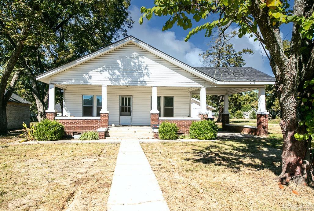Welcome to this spacious 3 bedroom, 2 bathroom home, a timeless gem built long ago that has had updates over the years. With approx 1800 sq ft, the rooms are large, perfect for relaxation or entertaining. The back room has the ability to be a primary suite or a second living room. The kitchen has vintage charm, gas stove, lots of cabinets. New vinyl plank flooring, new roof on house & older building out back, newer windows. Large laundry room & washer/dryer convey. Love the front porch and convenient location. Wonderful opportunity to embrace the charm of yesteryear and add your own modern flair. Seller is offering $15,000 at closing for updates, improvements, closing costs, rate buy downs or repairs. Agents see remarks.