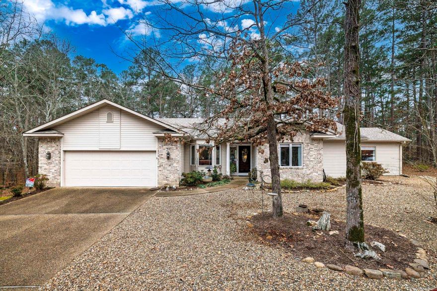 Prime Central Village Location! UPDATED 3BR/2BA/2Car home on flat lot with peaceful woods views, large deck; quick access to recreation center and Glazypeau gate. Bonus room addition sets this home apart. Large, bright room—perfect as game room, craft space, 4th bedroom, or second living area; features engineered hardwood floors, single French door entry, walk-in closet, picture window, exterior full-view door leading to a private deck. Dedicated LG mini-split provides separate heating and cooling. Open family room wi/fireplace, view of trees, dining area, covered deck. Flows into island kitchen with eat-in area, bay window, granite countertops, double sink, breakfast bar, quality appliances (Bosch dishwasher and Samsung slide-in range). Kitchen has been refreshed with luxury vinyl flooring, painted cabinets, new hardware, tile backsplash. Primary bath offers a spa-like feel with floor-to-ceiling large-format tile shower, rimless glass doors, quartz top vanity, semi-recessed ceramic sinks, and luxury vinyl flooring. Split primary bedroom with tree view, walk-in Closet. Popcorn removed, updated hardware, recessed LED lights, modern fixtures.  SEE DOCUMENTS FOR MORE HIGHLIGHTS!