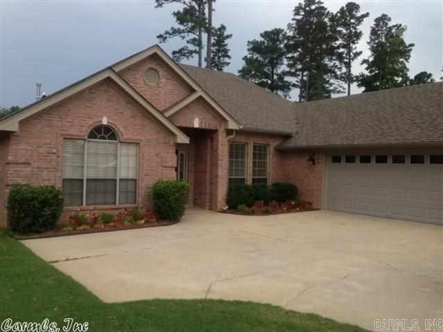 What a fabulous view of Country Club of Arkansas golf course and pond. Beautiful home in move in condition. Formal dining room is open to family room. Spacious living area with gas log fireplace. Master bedroom has wall of windows to enjoy the golf course view. Nice master bath with large walk in closet. Split bedroom plan. Very light and bright house. Over-sized garage for golf carts and attic is totally floored.  Level lot, gutters, nice landscaping and covered patio. Must see!…