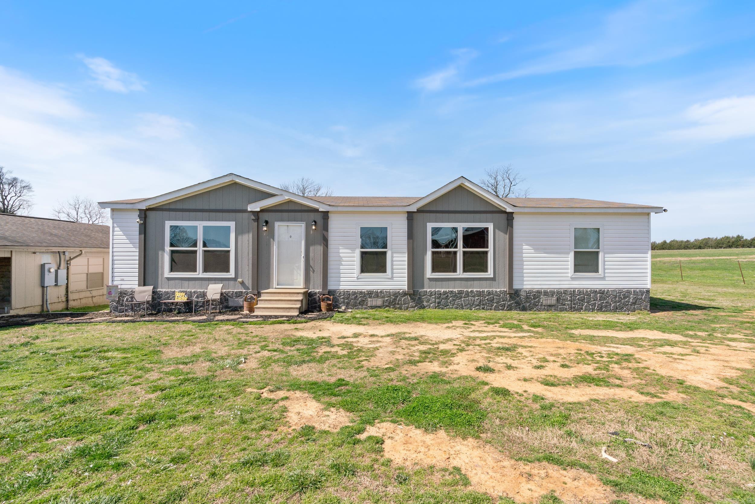 Nestled in the hills of North Central Arkansas sits this stunning 3 bed 2 bath mobile on 120 gorgeoues acres of land less than 10 minutes from Greers Ferry Lake! The mobile itself boasts all high-end fixtures and appliances and comes accompanied by a second home on the property that has been maticulously updated and would make for a perfect mother-in-law quarters, personal business or whatever you choose to utilize it for. Huge red metal barn comes with several stalls for horses, a tac room, water and electric, and huge pull through doors. The 120 acres is sectioned off to where every single pasture has its own spring fed pond, which are all stocked and loaded with fish. The acreage also boasts world class whitetail deer and turkey hunting with several high class deer being harvested every year for the past 8 years. And if that's not enough, take a small 10 minute drive up the highway and be on one of the premier bodies of water of the South at Greers Ferry Lake! Schedule your private showing today!