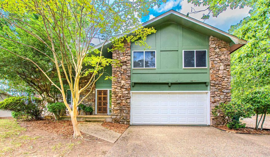 Ideally located on a quiet cul-de-sac with easy access to shopping, dining, and downtown, this updated home is move-in ready and perfect for entertaining. The huge family room features cathedral ceilings, wall-to-wall windows, and a stunning stone fireplace. The updated kitchen includes granite countertops and stainless steel appliances. Enjoy your morning coffee or entertain guests in the screened porch overlooking the private 1/2 acre lot, fully fenced backyard, and spacious deck. Three oversized bedrooms and updated baths. Sparkling hardwood floors, lovely built-ins, and contemporary touches throughout. Brand-new roof installed in May 2026. Beautifully maintained home with style and practicality throughout.