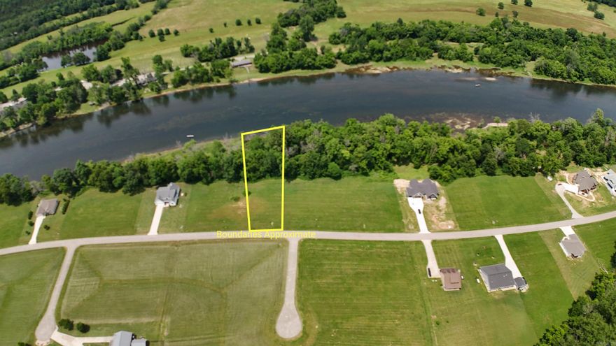 River frontage of 139’ with city water, Community septic and electric all at the property. This lot is on a paved road with level building site not in a flood zone. Community boat launch and gated entry. This lot is ready to build your dream home on. Bluff views out the front and river out the back. Minimum HOA fees.