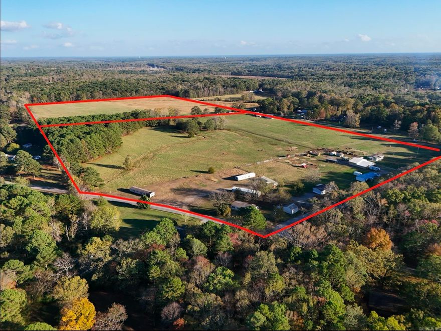 Great Development Opportunity!! This 77.71 Acres is a rare find. Located only minutes from Little Rock & Bryant makes it the perfect spot for a development. It includes a Horse Barn and is completely fenced. There are currently 7 Doublewide Mobile homes on the property. They can be purchased with the land or the seller will have them removed. Mobil Homes are currently rented with a monthly income of $6,000.