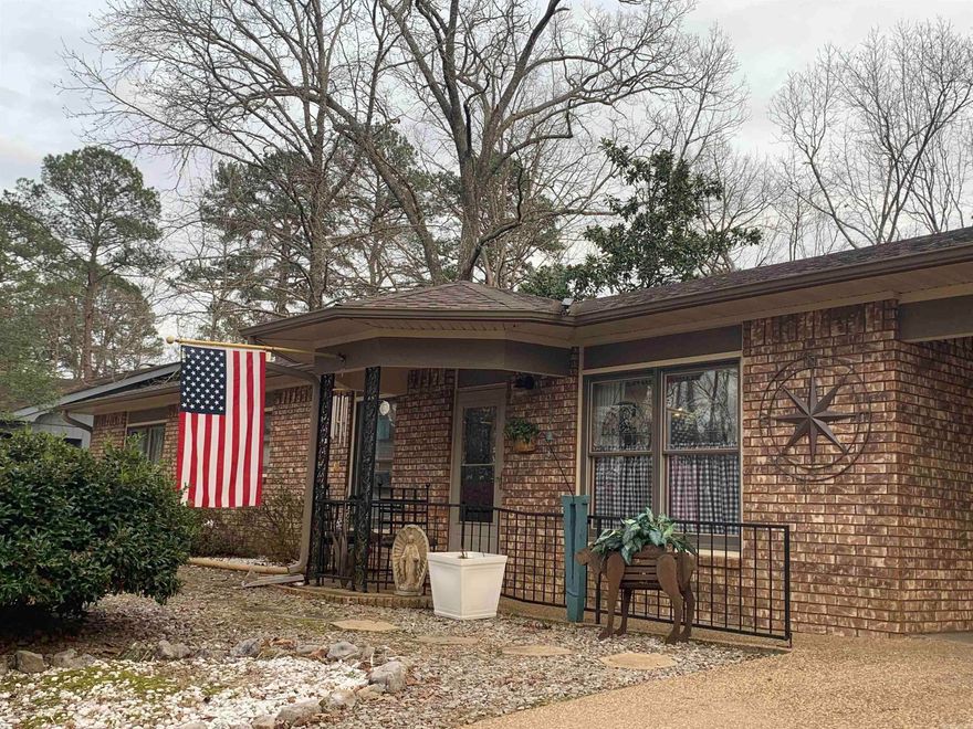 What if you could live in a quiet, wooded sanctuary but be at the pharmacy or grocery store in less than three minutes? This all-brick, two-bedroom, two-bath home offers comfort, convenience, and thoughtful updates throughout, including skylight and light fixtures. A spacious sunroom — with private access from the car port — provides flexible living space and could easily be converted into a third bedroom, home office, or hobby room.  Enjoy peaceful views with common property behind the home, creating a beautiful natural backdrop. The living room features a wall of built-ins, adding both charm and functionality. Recent upgrades include a new roof and gutters, new AC systems, new water heater, new kitchen appliances, and additional updates that make this home truly ready for its next owner.  The primary suite includes two walk-in closets and a custom curbless walk-in shower, offering comfort and accessibility. Storage is abundant throughout the home, plus a carport with an additional storage area. Step outside to a large deck and gazebo — perfect for relaxing or entertaining while enjoying the serene setting. $2,000 one time buy in fee, due at closing. (MORE PHOTOS COMING SOON)