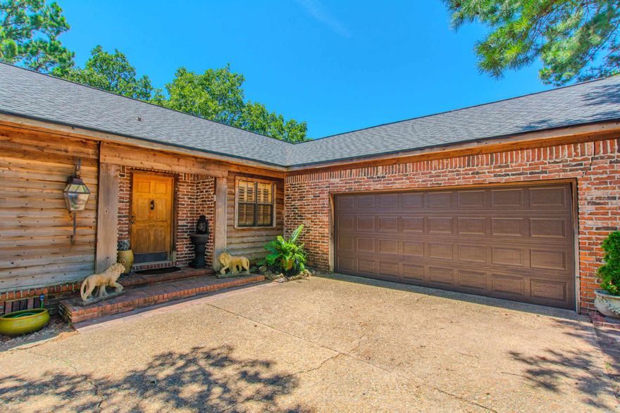 WOW, awesome home, just like living in an UPSCALE LODGE, nestled in a tree filled lot in a great subdivision! Gorgeous living room with large brick fireplace and tons of natural light! Office space right off living room. Great sized kitchen with extra storage, breakfast bar and pantry. The primary suite is amazing with fireplace, built-ins, vaulted ceiling, wood beams and door to deck! Split floorpan, hardwoods floors throughout, beautiful solid pine doors and floor to ceiling windows. Extra large tiered deck, perfect for relaxing and entertaining. Workshop area under house with outside entrance and lots of storage! BRAND NEW ROOF 2024! Make your appointment today!