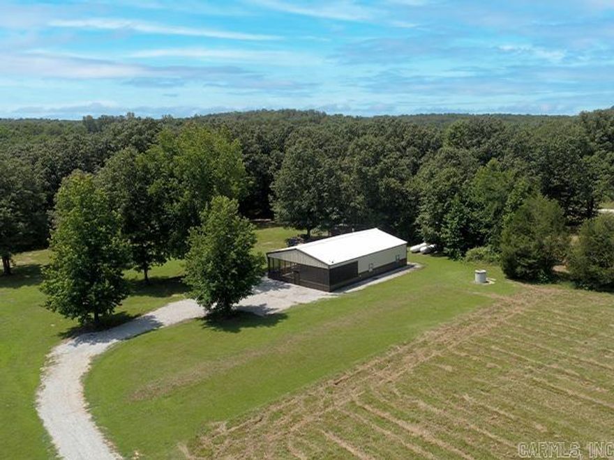 HOME-SHE SHED-29.5 ACRES- CREEK-POND!! Very nice 1600 square foot home sits on 29.5 acres! Built in 2017 the home has 2 ample bedrooms with large closets, 1 bathroom, lots of storage, big living room-dining-kitchen combination plus an 800 square foot screened in patio overlooking the pond. Lots of pretty woodwork put into this home! The adorable 560 square foot she shed was built in 2023 and comes complete with stove, refrigerator, washer and dryer. 2 sleeping areas, kitchen, living area and bathroom with walk in shower. Nice cozy porch to relax on in the evenings! Both home and she shed have central heat and air, well water and septic systems. Clay County Fiber Optic Internet available.  Huge pond that has recently been dredged and deepened. Complete with a wooden fishing dock.  There are three 1000 gallon propane tanks that stay plus a backup Generac generator if ever needed to run the main home. Surveyed. This is a dream property for the avid deer and turkey hunter or just for seclusion.