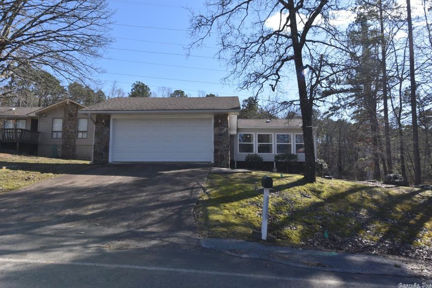 Furnished home centrally located in the bay. Would make a great full time or part time home.  Double car detached garage.  Nice heated and cooled sunroom wall of windows to enjoy the scenery of our area.  Nice wood floorings, Roof replaced in 2017,  new tiled walk in shower 2021. Newer appliances including washer and dryer. Stone fireplace to enjoy those cooler winter nights.  Within walking distance to restaurants, shopping, workout facility, hiking/biking trails, 10 min to Fairfield Bay Marina, within 5 min to Mountain Ranch golf course, small fenced back yard. Fairfield Bay also offers 3 swimming pools, bowling, tennis & pickle ball courts.  Come and check this one out today.