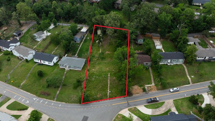 Discover the perfect canvas for your dream home at this residential vacant lot located in the desirable Kingwood Place subdivision. Nestled in a tranquil neighborhood, this lot offers a unique opportunity for homebuyers and builders alike. This lot provides easy access to local amenities, schools, shopping, and parks, making it an ideal spot for families and individuals looking for convenience and community. The lot spans a generous area, providing ample space for a custom-built home, outdoor living, and landscaping. All necessary utilities, including water, electricity, and sewer, are readily accessible, simplifying the building process. There is access to the back of the property on the North side that can be used for parking. This vacant lot is a rare find in Little Rock, offering both privacy and community living. There is a existing car port on the back drive that you can locate on the survey.