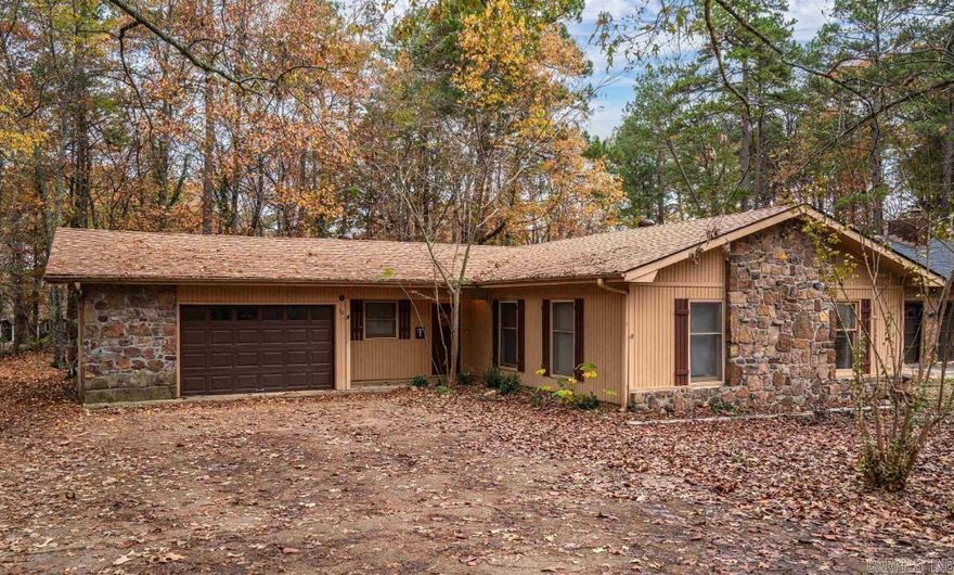Beautiful home located in Hot Springs Village on level wooded lot.  New roof 2022, Desoto Golf Course, restaurants, banks and shopping nearby.