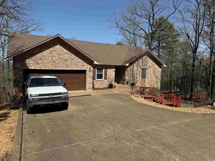 Absolutely beautiful all-electric home w/two living spaces w/a separate entrance nestled in the countryside of HSV overlooking Lake DeSoto and mountain views. The rear of the homes has two lighted decks that stretch the full length of the home for spectacular views all year round. Kitchen has beautifully naked cabinets. Granite counter-tops and backsplash. Name brand appliances throughout. Exit MBR to deck thru sliding doors to jacuzzi hot tub. The lower level can be used as in-laws quarters, living space for additional family members or rental. Extra room can be used for working at home w/your own office space. Large WIC. Underneath home is unfinished basement. Two HVAC units. Beautifully hardwood and VFP flooring throughout, tile in bathrooms w/soaking tub. Safe room. Fenced backyard. Granite face FP w/wood frame. Cabinets galore w/sink in laundry room. Come one come all to see your new or vacation home, or a great Airbnb. Move in ready. Call today for your personal showing.