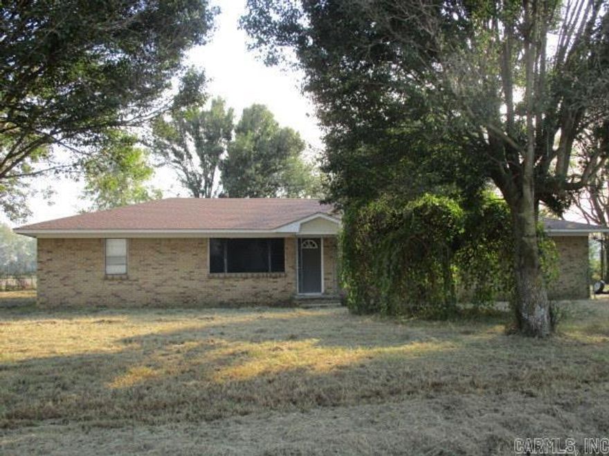 Investment Opportunity for this 3 BR / 2 BA all Brick Home sitting on 1.0 acres on a paved road. Metal Outbuilding in Chain Linked Fenced Yard. Roof has been replaced in the past several years and the AC unit was new in 2011.  Property to be sold "AS IS".  No Property disclosure is available. Trash out will be completed by 11/2/24.