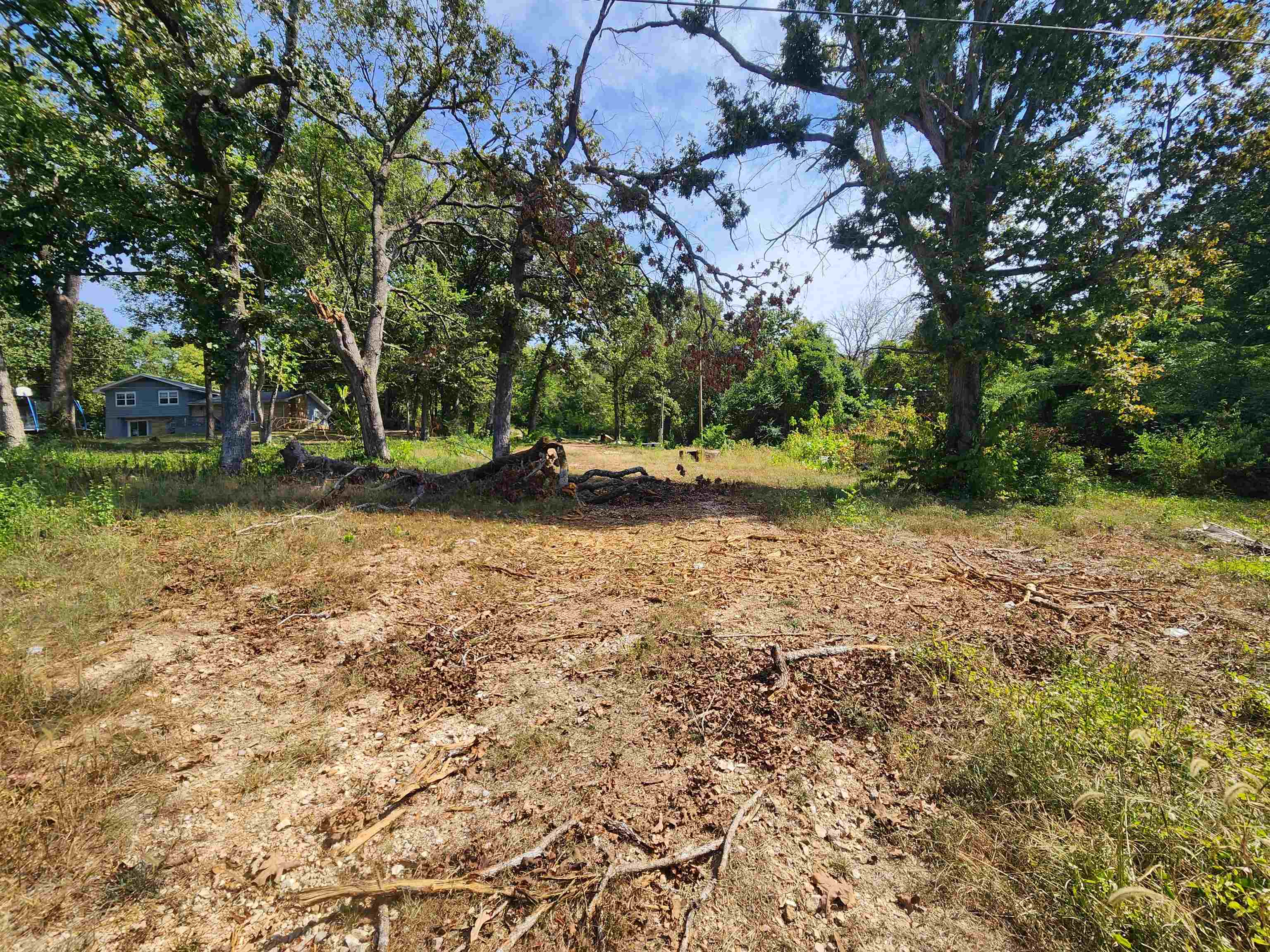 5.5 Acres of property inside and outside the city limits of Hardy Arkansas. This property has a new well and pump set on site. Drilled approximately a year ago. There is power onsite as well. There was originally a stone homestead located here, so there should be a septic system in place. Most recently a mobile home was on the property but has since been removed. Seasonal views of the beautiful Spring River could be outstanding. This could be an awesome homestead with the acreage running south to north out of the city limits. So, you have the best of both worlds. With a little cleanup it could be a wonderful homesite. Not too many of these properties out there. Land with all utilities is a rare find, especially at this price. Only 2 miles up the highway from Old Hardy town for shopping, dining and entertainment. Schedule a visit and see this opportunity in person.
