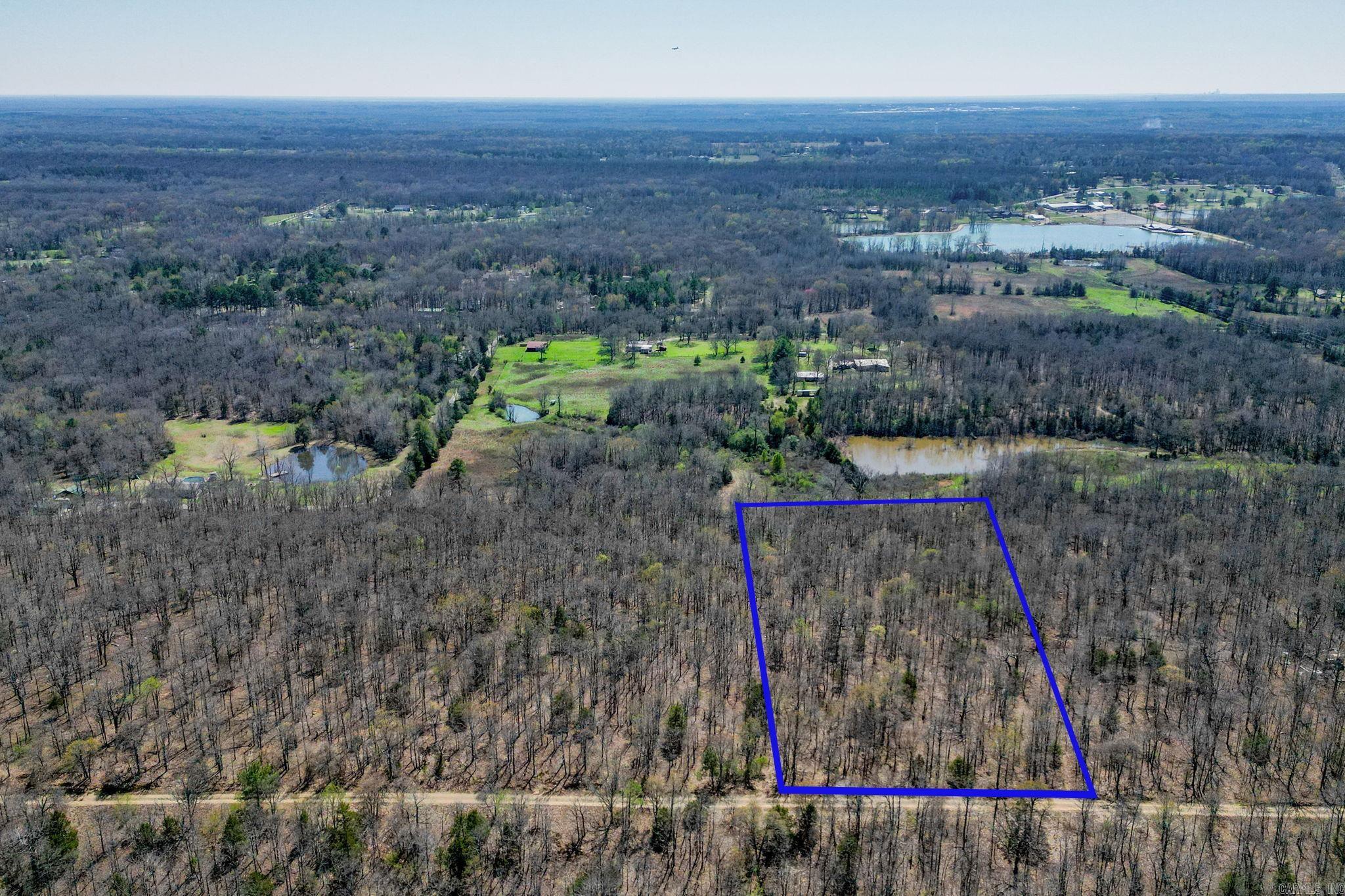 Whether you envision a sprawling estate, a cozy cabin retreat, or a sustainable homestead, this land provides endless possibilities for customization and development. This land has already had a soil pit sampled on Feb. 23, 2024 for a 4 bedroom home, and the soil was determined suitable for individual on site- wastewater disposal for a septic system. Agents: Please see attached survey. There are NO restrictions on this land!! This land is currently not on county water, so it will require buyer to establish a well.