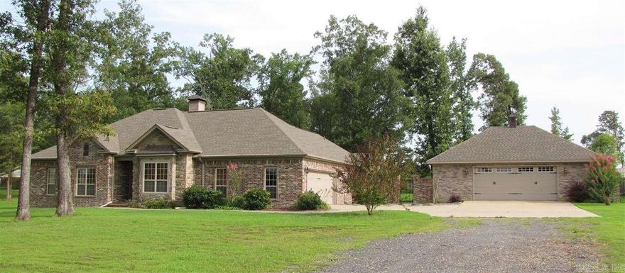 Beautiful high-end home with a large 26X36 matching shop.  The home is on a corner lot, approx 1.63 acres, separate master suite, "elaborate master bath" with electric fireplace, large jacuzzi tub, walk-in tile shower with glass enc., exquistie tile work & w/i closet. The kitchen is a must see with a double stainless steel refrigerator, island with granite counter and breakfast bar, wine cooler, ice mach., gorgeous stone fireplace in the great room with french doors opening to sunroom, lrg patio & much more