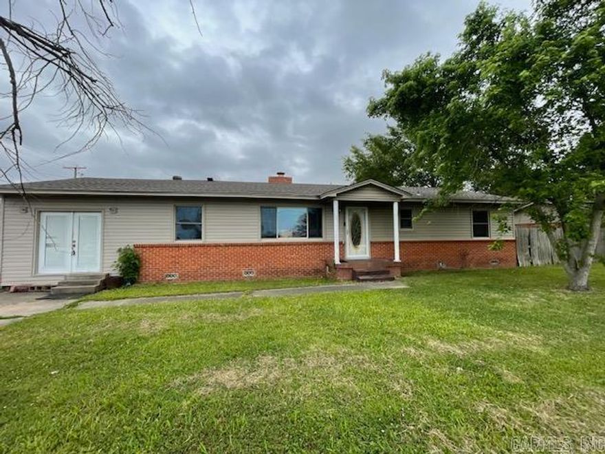 House sitting centrally located on the corner.  Spacious storage and deck off back.  Circle drive connecting 19th and Buerkle.  Home being sold as is.