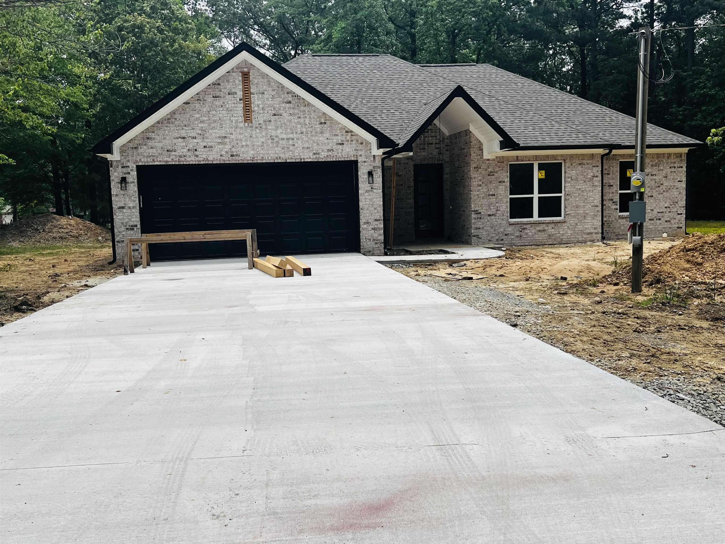 .Stunning new construction 4-bedroom, 2-bathroom OR 3 bedrooms & office home designed with style and functionality in mind! This thoughtfully crafted home features an open-concept living area and kitchen, complete with a cozy electric fireplace. The split floor plan offers privacy, with a large master suite as a true retreat, featuring a soaking tub, walk-in shower, and spacious walk-in closet that connects conveniently to the laundry room. Ample storage is found throughout, along with custom touches that add unique charm. Relax on the covered back patio and enjoy every detail this home has to offer!. NO HOA