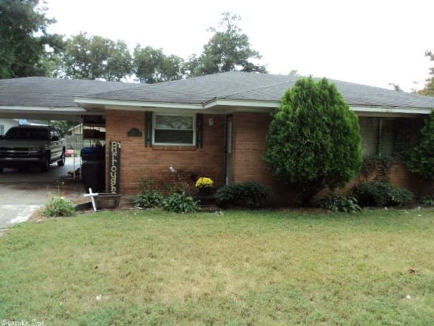 Brick home in the center of Carlisle. Huge corner lot with storage building. See agent remarks.