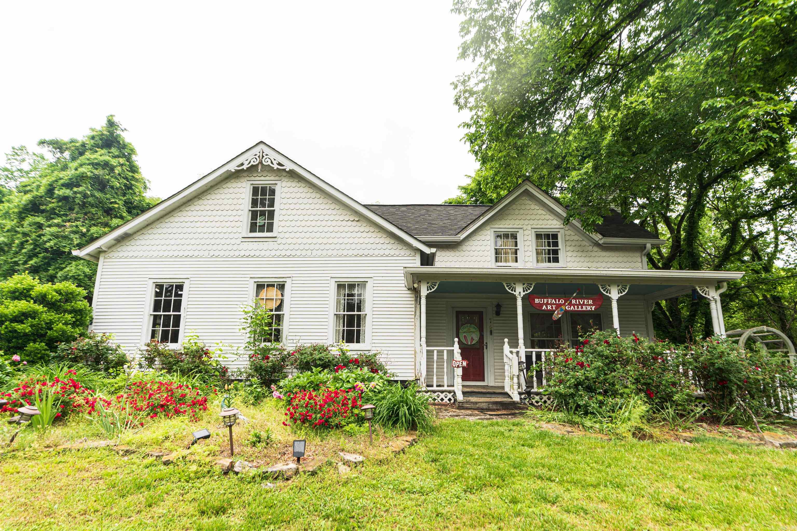 Built in 1920, this charming and versatile home sits just up the road from Buffalo River access and is currently used as an art gallery. Recent updates include a new roof (2023), new heat/air system with 3-zone central HVAC, new ductwork, and an updated septic system. The back decks have been completely rebuilt, providing refreshed outdoor living space. Inside, you’ll find beautiful hardwood floors, generous square footage, ample storage, and a custom kitchen with built-in cabinetry. The outdoor space features a fenced garden, storage shed, covered canoe/kayak storage, and a firepit for enjoying the night sky. Whether you're looking for a full-time home, vacation getaway, or a turnkey short-term rental, this property offers incredible Airbnb or investment potential. Located in Gilbert, the only incorporated town on the Buffalo National River and Arkansas’ only Dark Sky certified community. A favorite seasonal destination, Gilbert is also known as the coolest town in Arkansas—a truly rare opportunity to own in one of the state’s most unique and peaceful places.