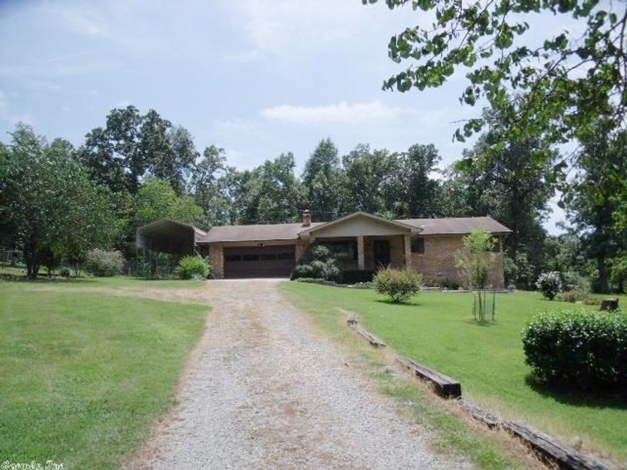 All Brick home on 1 ac m/l with extra landscaping two car garage and Large RV Carport.  Open floor plan and tremendous closet space.  Sun room overlooks very private back yard.  Long covered front porch.  New commodes.  Minutes to Lake Norfork, Wal-Mart or the golf course!