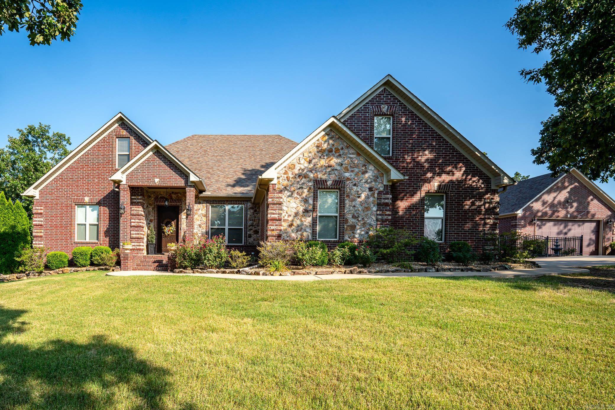 Come see this beautiful, spacious home that sits on 3.09 acres, right outside the Greenbrier city limits. This home is semi secluded from neighbors with a partial view of the valley below. The master suite has recently been remodeled to feature a gorgeous custom tile shower, free standing tub, and gorgeous quartzite countertops. This home features spray foam insulation, a new gas tankless hot water heater (2022), newer kitchen appliances, surround sound, sprinkler system, 2 car shop, mature landscaping, gunite pool, and many more updates the current homeowner has recently done.