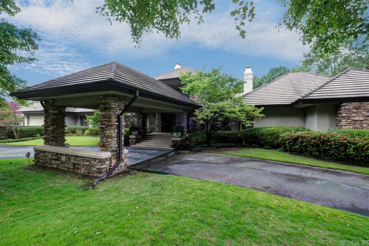 This gorgeous custom Frank Lloyd Wright inspired hm on Chenal Golf Course overlooking the lake will take your breath away. Enjoy the views from 25' soaring windows of the Great Rm while relaxing in front of the huge native stone fireplace. Cooks kitchen w/abundant cabinets & unique stone fireplaces in the breakfast rm & den. Luxurious Master suite as well as guest suite and study on main. White oak spiral stairs to guest suite & two guest rms w/shared bath. Pool w/waterfall, 4 verandas, much more. Come see!