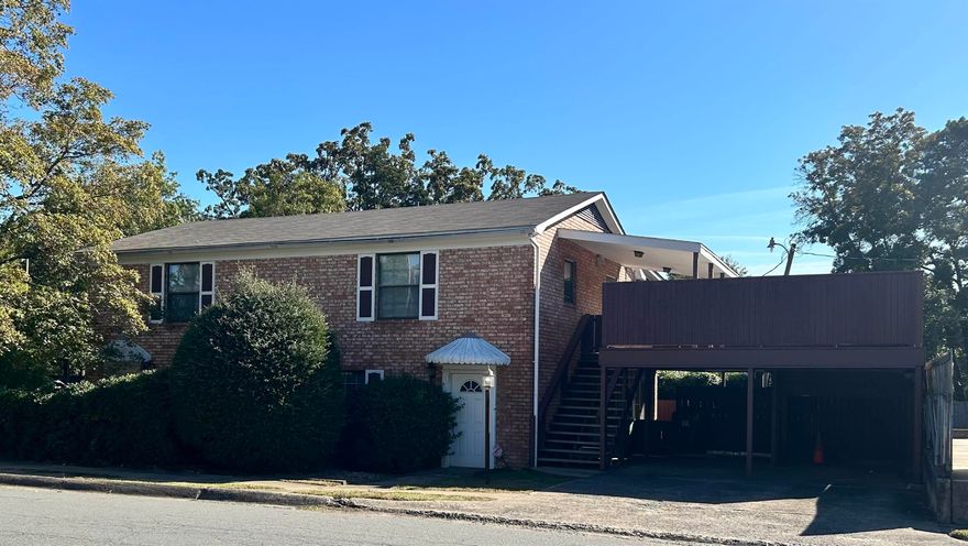 Zoned Office. Seller used downstairs as public office and lived upstairs. 2 half baths on bottom level and 2 full baths upstairs. Some parking on east side and street parking. 2 car carport.  Storage shed included.