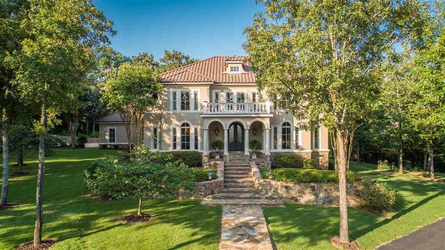 Beautiful, custom built Classic Italian Renaissance style home w/ clay barrel tile roof. 5BR/4BA w/ 2 half baths. The eat in kitchen offers center island, granite countertops, double wall ovens, warming drawer & gas cooktop. You'll find the master suite on the main level w/ double vanities, steam shower & jetted tub. Solid walnut floors downstairs. Game room, den w/ gas FP, & bar is upstairs. Covered porch overlooks the beautifully landscaped yard w/ heated gunite pool & hot tub. Wonderful for entertaining!