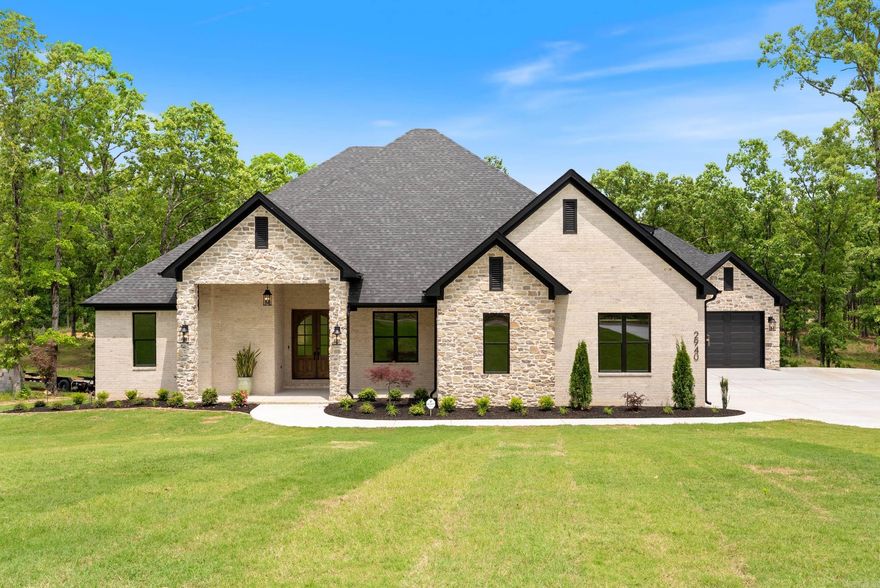 Stunning executive estate on Round Mountain! Gorgeous entryway with paneled walls that leads to the large living room with a beautiful wood beam and fireplace that serves as a centerpiece. Open floor plan with chef's kitchen. Quartz countertops, gas stove, oven with convection microwave. Wine fridge and Costco Door in pantry. Beautiful hardwood floors downstairs in non-wet areas. Primary suite with custom tile shower, separate air tub, and large closet that connects to laundry room. Jack and Jill bathroom with Terrazzo tile, and two walk-in closets. Executive study/office with custom paneling. A 4th downstairs bedroom has a full bath with tile shower. Upstairs you'll find a 5th bedroom, half bath, and media room that could also be used as a bonus room or kid's play room. The oversized back porch is an entertainer's dream. Outdoor kitchen with granite countertops, sink, fridge, and gas/electric hookups for a grill. The patio is wired for a t.v. and Sonos bluetooth audio. Screened-in back porch with privacy screen. Mature trees give this estate a country feel while allowing for easy access to schools, shopping, and restaurants. On Conway Corp! Realtors, see PDF for more features.
