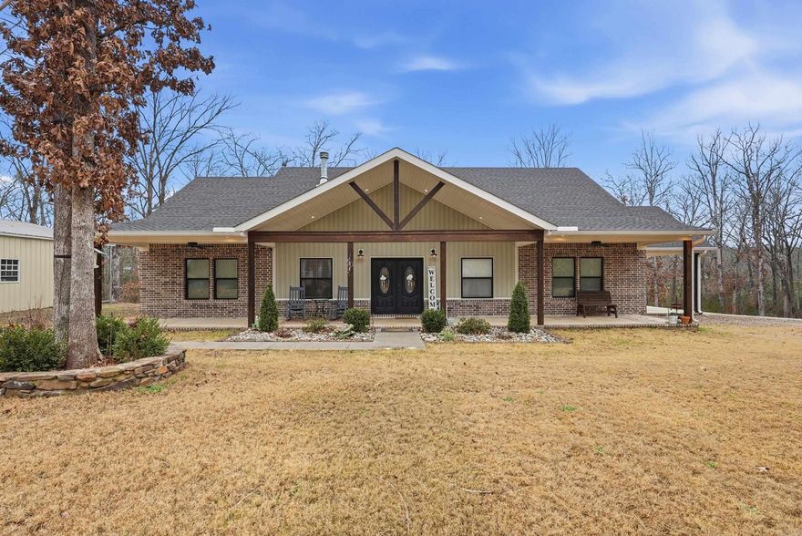 Welcome Home to Peaceful Country Living. Nestled on a quiet street surrounded by nature & mature trees, 31 Griffin Ln Houston, AR is the kind of place that feels like home the moment you pull in the drive. Built in 2022, this beautiful 3bed, 2 bath home with a flexible office space offers 1,920sqft of thoughtfully designed living space on approx 6 serene acres, about 25 miles from Conway. Step inside to an open-concept featuring luxury vinyl flooring throughout and a cozy wood-burning fireplace. The farmhouse-style kitchen is truly the heart of the home with a farmhouse sink, granite countertops, bar seating, gold hardware, and a rustic wood vent hood reclaimed from an old barn, giving this home stories to tell from the start. A spacious pantry keeps small appliances tucked away and countertops clutter free. The primary suite is extra spacious, complete with a large walk-in closet and a spa-like bath featuring a soaker tub and a beautiful walk-in shower. Enjoy peaceful mornings or quiet afternoons on the covered front and back porches, soaking in the sights and sounds of nature all around you. Need extra space? Property includes 30x300 enclosed shop w/ 10x30 lean-to.