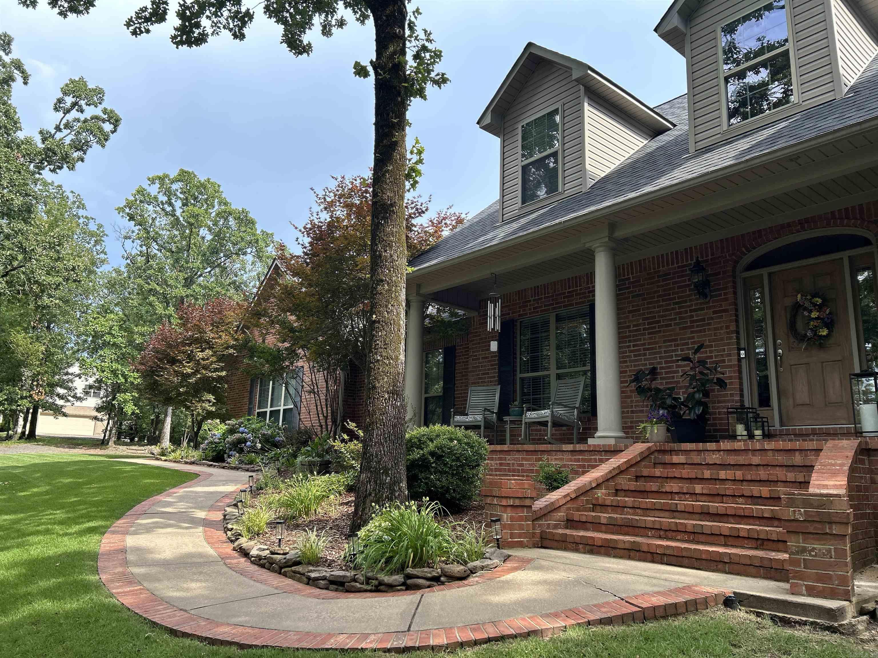 This stately home sits on a quiet wooded ridge, and features a gorgeously updated kitchen, a large back deck overlooking the trees, an elegant curving wood staircase! Don't miss the workshop area in the three-car garage, or the outstanding bonus room upstairs.