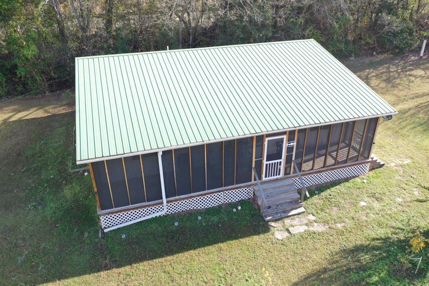 FISHERMAN'S RETREAT! Check out this 2 bedroom, 1.5 bath cabin located in the Mount Olive area that comes mostly furnished! Located less than 1 mile from the Arkansas Game & Fish boat ramp, this property would make a great vacation rental or getaway cabin! The home features a large living area and an open kitchen/dining room. Both Bedrooms are spacious with one having an attached 1/2 bath. There is a large screened in front porch, several fruit trees, and a 18x20 shop building!