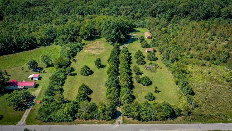 Serene, Secluded 5+ acres in Lonoke.  Check out this beautiful fully fenced land with existing cabin and Ready to Go Build Site.  Build site already has septic, water, and electricity.  Cabin comes fully furnished including New Washer, New Dryer, New Refrigerator, New Stove, New Microwave and furniture. Cabin also has bonus space that could be used as small bedroom or closet.  This property includes outside storage building and additional Large Detached Garage!  Pond has been started on back of property. It's an Amazing Find. Don't miss out! Please see agent remarks for additional information.