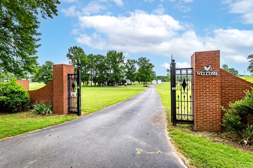 Live in tranquility just minutes from the city! This stunning estate sits on 7.5 +/-acres of landscaped grounds. Custom-crafted molding throughout home.  Spacious kitchen with site built cabinets. See through fireplace in family room and kitchen area. Master is separate, has a luxurious master bath. Garage is 1640 sq.ft. heated and cooled, designed to entertain, has kitchen area, 1/2 bath, cedar lined closet. A must to see. Has a  540 sq.ft.est upstairs room with half bath, heated and cooled. Great for parties or living area! Separate work shop, enclosed garage for a 50ft. Motor coach. Barn for 4 horses. You will love the out door breezeway! Don't miss this opportunity, schedule your showing today!  We have replated the other 5.2acres, which includes the barn and right side of property. It will not be apart of this parcel. You can see the survey ribbons to show where this property ends, about 18 feet from the driveway.