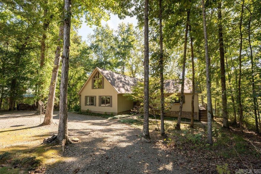Enchanting Riverfront Retreat in Heber Springs! Discover paradise at 130 River Mountain Drive, Heber Springs, AR—a stunning riverfront retreat on 1.6 acres with 180 ft of private Little Red River frontage and majestic Sugarloaf Mountain as your backdrop. Wake to river whispers and mountain vistas, perfect for trout fishing, kayaking, or hiking nearby trails. Outside: Custom walkway leads to your private dock for endless water adventures amid crystal-clear currents. Inside this 3,314 sq ft gem (built 2002): Oversized rooms bathed in light from abundant windows framing river/mountain views. Cozy up by the custom stone fireplace, cook in a gourmet kitchen with hickory cabinets, enjoy a spacious laundry room, and unwind in the loft’s bonus game room—ideal for family fun or relaxation. This isn’t just a home; it’s a lifestyle of serenity and excitement. Own your Arkansas escape today—schedule a viewing and let the magic unfold!