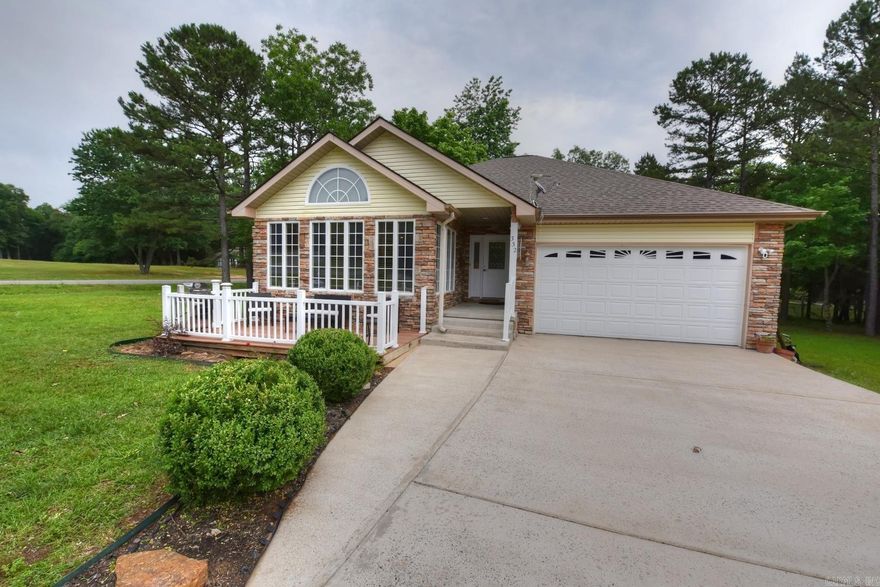 Welcome to this furnished one-level home located in the heart of Fairfield Bay, Arkansas, just across the street from Indian Hills Golf Course. Situated near the picturesque Greers Ferry Lake and surrounded by an abundance of amenities, this home offers the perfect blend of tranquility and convenience. As you step inside, you'll be captivated by the spaciousness & elegance of the vaulted ceilings, which lend an airy & open atmosphere to the entire home. The centerpiece of the living area is a charming stone gas fireplace, providing both warmth & a cozy ambiance on cool evenings. The front porch beckons you to relax and unwind as you soak in the breathtaking views of the golf course, creating the perfect spot for enjoying your morning coffee or an evening glass of wine. Meanwhile, the rear deck offers an idyllic setting for entertaining guests or simply enjoying the serene surroundings. The master bedroom is a true retreat, with its own private access to the back deck, allowing you to easily immerse yourself in the beauty of nature. The attention to detail is evident in every corner of this home, including Anderson windows.  Golf course lot for sale across the street for $5,000.