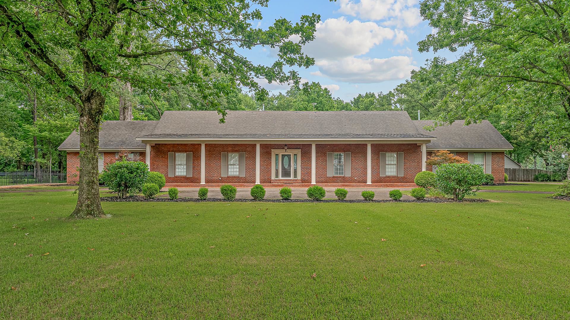 Burdette Arkansas ~ A beautiful setting on 1.86 acres with 4 bedrooms, 3 full bathrooms & all have double sinks, & 1/2 bathroom. Vaulted ceilings in living, separate dining, kitchen has 2 side by side refrigerators with freezers, island, & eat-in kitchen area. All bedrooms are spacious with lots of closets & storage. Outside is a dream with screened in porch leading to the arbor covered area featuring built in grilling area, fireplace, firepit, & fountain and all surrounded by beautiful lawn & landscaping. TWO large shops: 1 with concrete flooring, 1 with gravel flooring. This is an amazing home & location. Call your favorite realtor today!