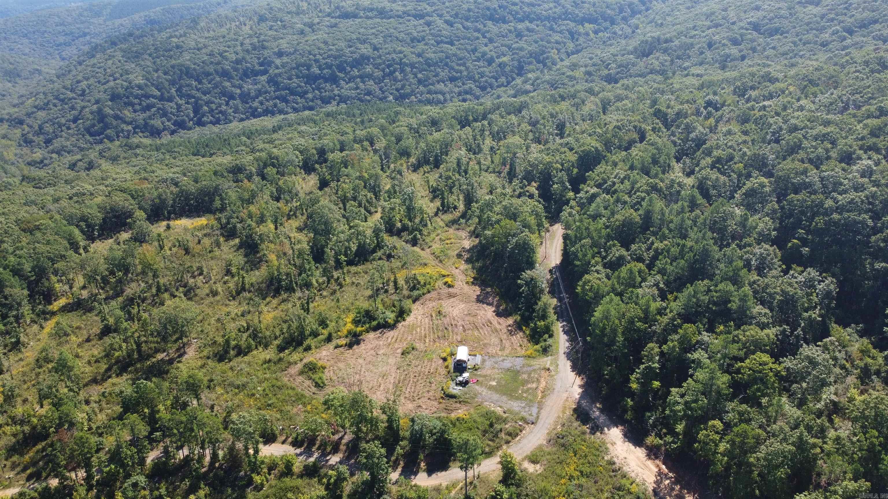 175 +/- Acres of Ozark Mountain Land ā Private, Peaceful, and Ready for Your Vision!! This stunning 175-acre property in the heart of the Ozarks offers the perfect mix of seclusion and convenience. Behind a locked gate with a deeded easement gives you privacy, while electric and high-speed fiber internet are easily accessibleāso you can stay connected even in the middle of nature. The land features rolling terrain, scenic views, creek, waterfalls, rock outcroppings, overhangs, and a mix of hardwoods and pine, including marketable timber. Wildlife is abundantāwhitetail deer, turkey, bear, and small game make this a hunterās paradise. Whether you want to build a forever home, weekend cabin, hunting lodge, or simply invest in land with endless recreational potential, this property delivers. No restrictions, a clearing offers a great build site with great views of the surrounding mountains. Numerous other potential build sites. Just 15 minutes to Clinton for daily needs, 25 to Greers Ferry Lake for water fun, 1 hour to Conway, and a little over 2 hours to Branson, MO. Endless possibilities with this one. Come experience the peace, space, and tranquility of the Ozarks!