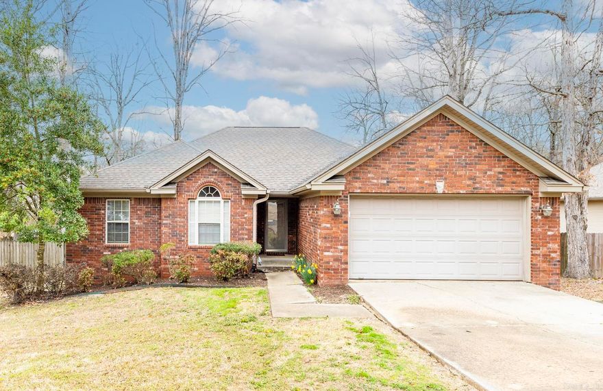 Nestled right in the heart of Saline County, this 3 bed, 2 bath home is ready for new owners! The oversized living room has huge windows, a gas fireplace & is open to the kitchen and dining. You'll find plenty of cabinet space & an island with bar seating in the kitchen. The primary suite is separate from the other 2 bedrooms with tray ceilings and a spacious bathroom with 2 closets, a walk in shower and jacuzzi tub. The covered deck patio/deck is perfect for entertaining and enjoying the large, fully fenced back yard. Schedule your showing today! Agents, see remarks.