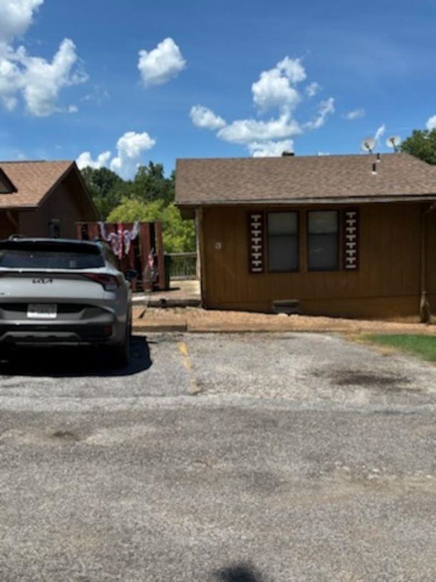 This large 2 bedroom (could be 3) 2 bath townhouse is in the heart of Cherokee Village in the foothills of  the Ozarks. Only a few feet from the indoor pool and only a mile to the Southfork of Spring River. There are 7 lakes, 2 award winning golf courses, several picnic and recreation areas for your enjoyment. The last 2 pics are of the indoor pool that is a few hundred feet away! This home needs a little TLC but for this price and square footage what do you have to lose? Priced at $89,900 and ready for a new owner!