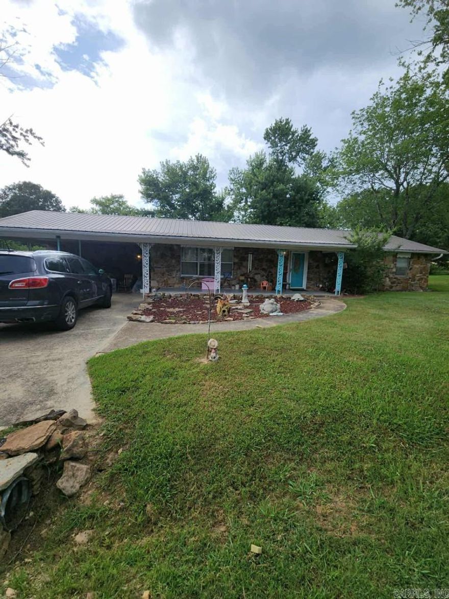 Charming 4-Bedroom Home with Guest Cottage Near the White River – Seller Financing Available!Beautifully 4-bedroom, 2-bath home with a spacious primary suite set apart from the other bedrooms for privacy. The layout includes a separate dining room between the living room and kitchen, plus a utility room with storage. A 2-car carport provides covered parking.Behind the main home, a private driveway leads to a versatile guest cottage or nightly rental. This studio-style space offers an open living area with kitchenette, a cozy bedroom, and a full bath with soaking tub.Conveniently located close to town and just a couple of miles from the scenic White River.No bank financing needed — seller is offering owner financing on this property!